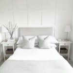 Grey headboard on white panelling